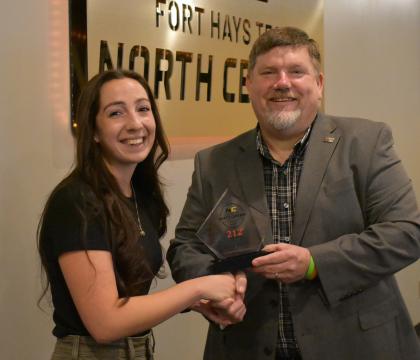 Alyssa Deneke receiving 212 Award.