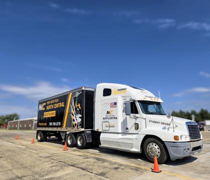 CDL truck in parking lot.