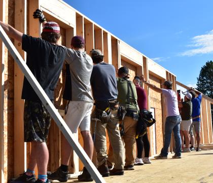 Construction Technology students building a wall.