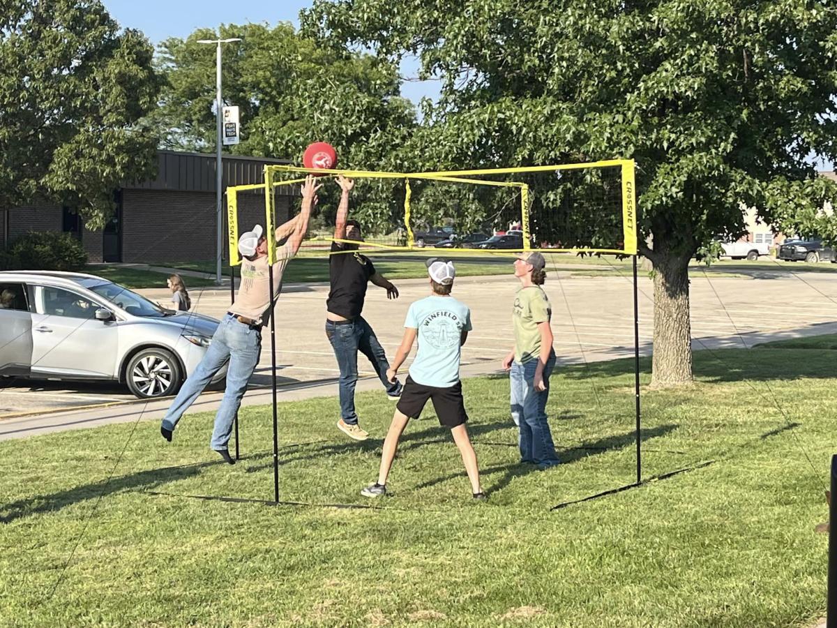 Students playing vollleyball.