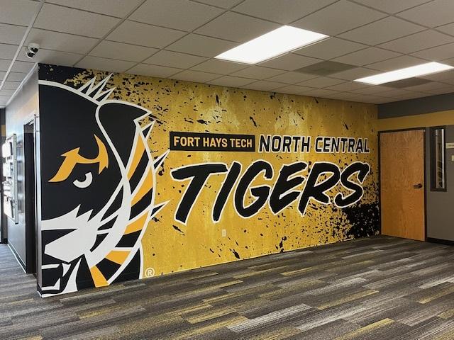 Business Occupation Center wall with a Tiger mural.