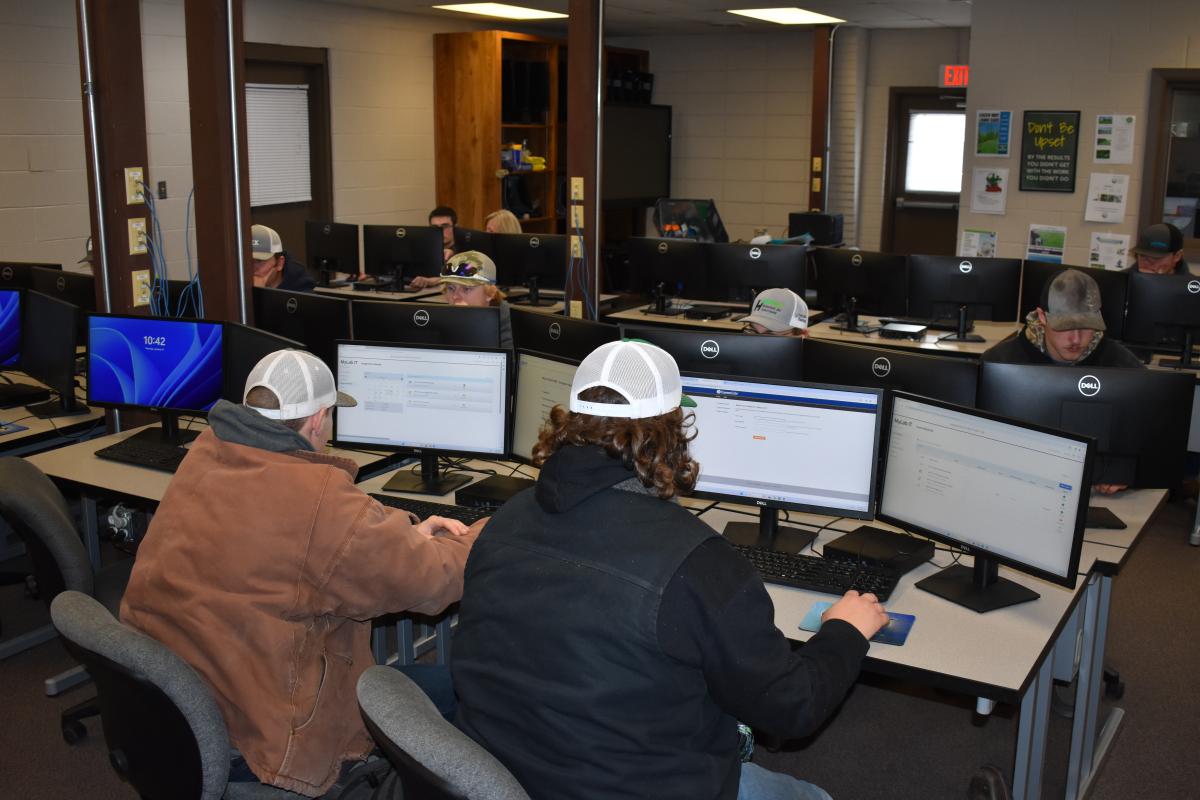 Two students working at a computer.